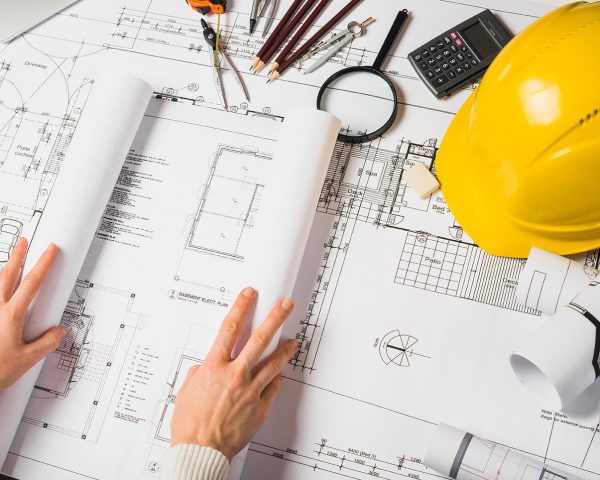 crop-architect-opening-blueprint